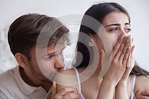 Loving man soothing crying woman, apologizing after quarrel photo