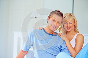 Loving middle aged couple spending time together at home. Portrait of a loving middle aged couple spending time together