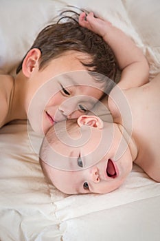 Loving Mixed Race Chinese and Caucasian Baby Brothers Embracing
