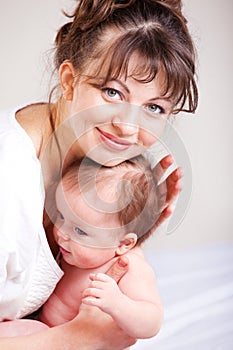 Loving mom holding baby