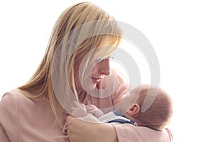 Loving mom holds her newborn baby in her arms, cute tiny baby. Portrait a Mom and her baby. The concept of a happy family