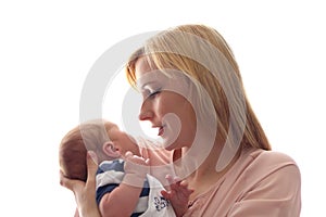 Loving mom holds her newborn baby in her arms, cute tiny baby. Portrait a Mom and her baby. The concept of a happy family