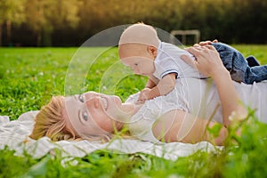 Loving mother with her newborn baby on her arms.