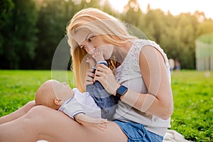 Loving mother with her newborn baby on her arms.