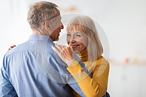 Loving Older Couple Dancing Celebrating Anniversary At Home