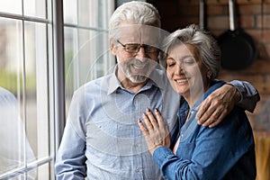 Loving older senior family couple enjoying tender sweet moment.