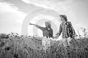 Loving relationship. man and woman in poppy flower field. summer vacation. happy family. country music. spring nature