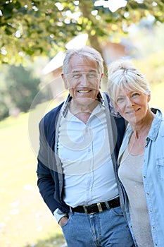 Loving senior couple outdoors walking