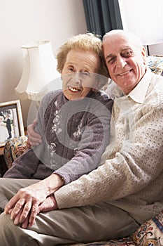 Loving Senior Couple Relaxing At Home