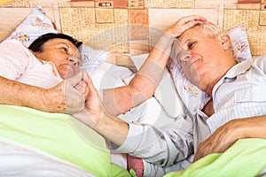 Loving seniors in bed