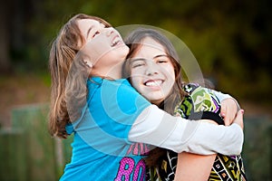 Loving sisters hugging and smiling