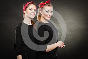 Loving sisters in retro pin up stylization.