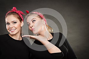 Loving sisters in retro pin up stylization