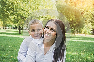 Loving son kissing his happy mother on the cheek