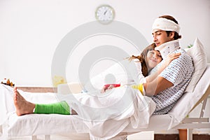 The loving wife looking after injured husband