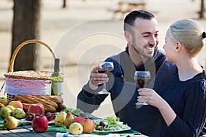 Loving young beautiful happy couple drinking wine