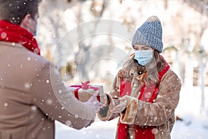 Loving young couple exchanging presents for St. Valentines Day