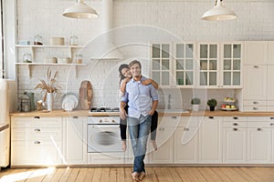 Loving young couple homeowners glad of buying new kitchen furniture