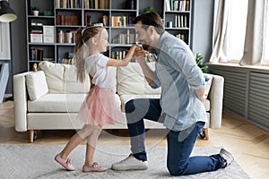 Loving young dad play with little preschooler daughter