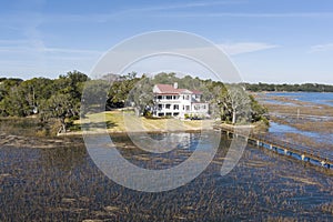 Low aerial view of the historic Tidalholm house in Beaufort, South Carolina from the water