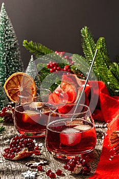Low alcoholic cocktail with fruits syrup and ice. Sparklers, Christmas traditional decor, New Year