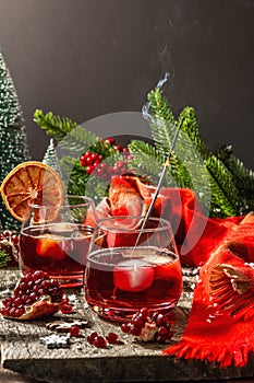 Low alcoholic cocktail with fruits syrup and ice. Sparklers, Christmas traditional decor, New Year