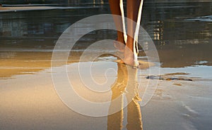 Low angle african american woman walking on beach