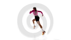 Low angle back view image of young sportive woman, running athlete in motion, training isolated on white studio