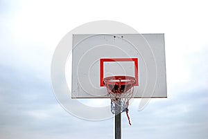 Low angle of basketball hoop with red white blue net