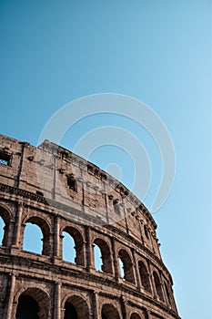Low angle Beautiful scenery of the circular Colosseum, Rome, Italy under a blue sky