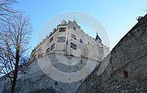 Low angle of Brunico castle in winter time, sunny day, Bruneck in Puster Valley, South Tyrol, Italy photo