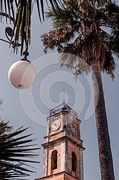 Low-angle of chapel of the Holy Cross on  a sunny day, trees and a clear sky background