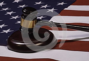 Low Angle Close Up of Gavel Standing Up on Sounding Block with United States