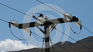 Low angle closeup of the powerline captured during the daytime