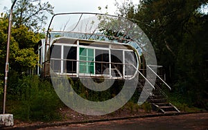 Low angle dramatic shot of an old rusty abandoned house near the forest in Wanli UFO Village, Taiwan photo