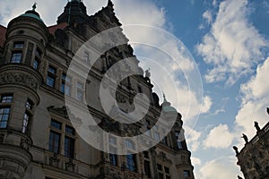 Low angle of Georgentor against the blue, cloudy sky in Dresden, Germany photo