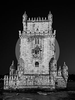 Low angle grayscale shot of Garden of Belem Tower in Lisbon Portugal at night