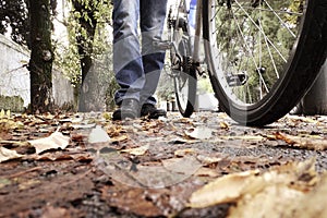 Low angle of a man with his bicycle