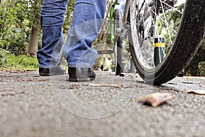 Low angle of a man with his bicycle