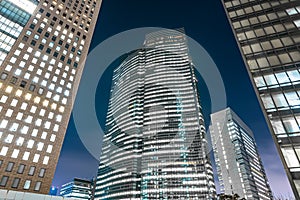 Low angle of the Shiodome City Center at night in the Shiodome area of Minato, Tokyo, Japan