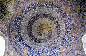 Low angle shot of the beautiful ceiling of Shah Mosque captured in Isfahan, Iran