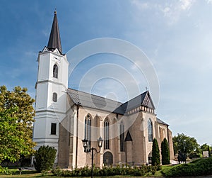 Low angle shot of a beautiful church exterior against a blue cloudy sky