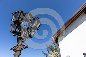 Low angle shot of beautiful metal street light over a blue sky