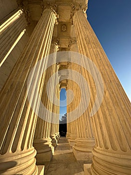 Low-angle shot of the big columns of the Supreme Court of the United States on a sunny day