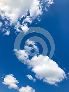 Low angle shot of a blue cloudy sky at daytime - perfect for wallpapers