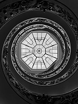 Low-angle shot of the Bramante Staircase ceiling (Scala Elicoidale Momo) in Vatican City