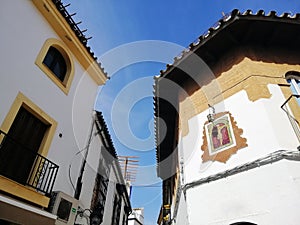 Low angle shot of buildings in CÃÂ³rdoba, Spain with a clear blue sky in the background photo