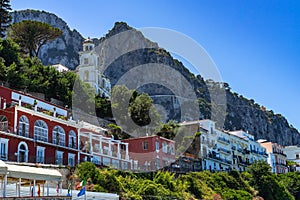 Low angle shot of buildings lined along the coastline of Marina Grande in Capri, Italy