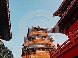 Low angle shot of the buildings under the sunlight in the Millennium City Park, Kaifeng, China