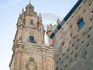 Low angle shot of The Casa de las Conchas under the sunlight in Salamanca, Spain